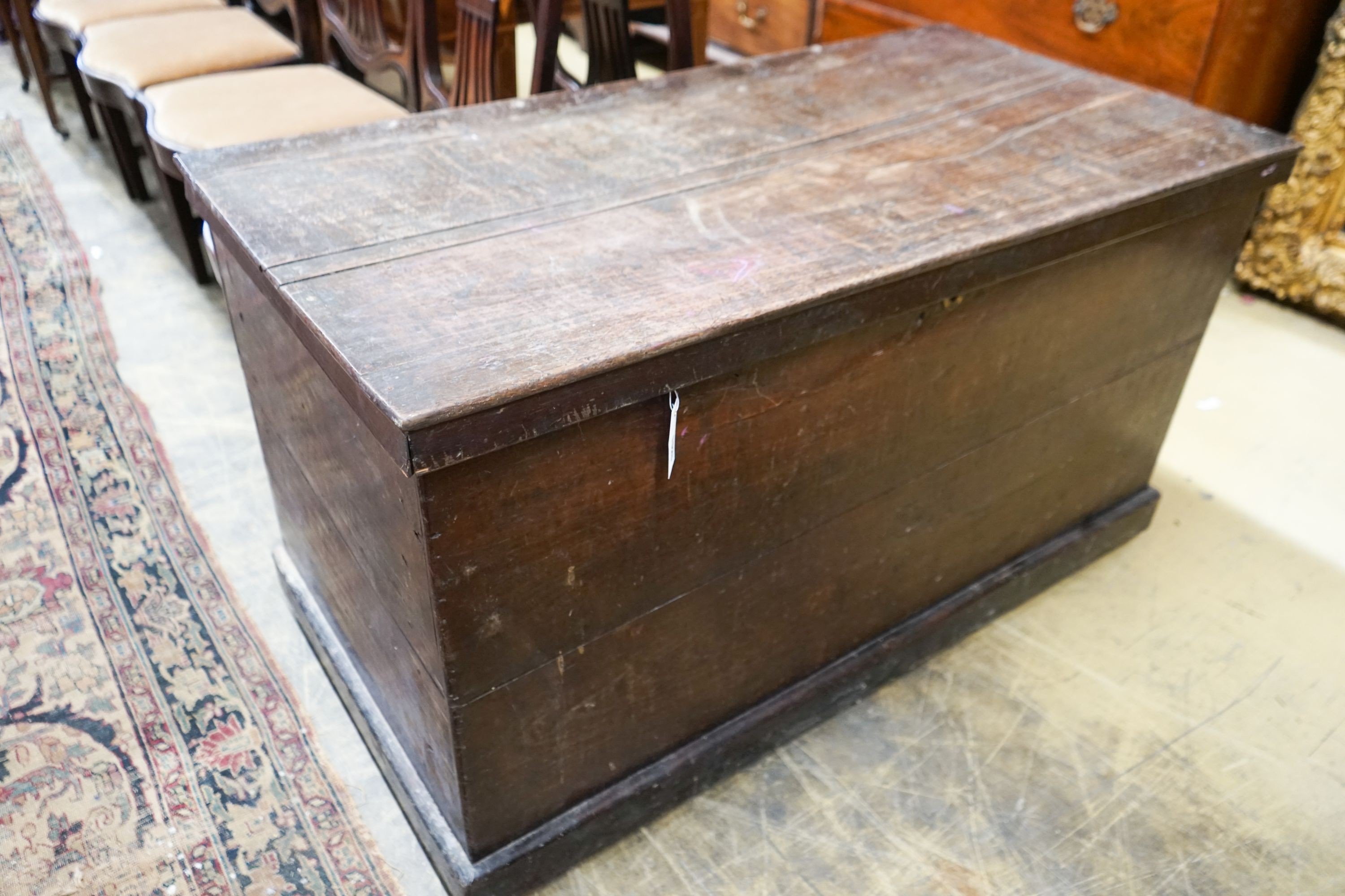 An early 19th century rectangular oak trunk, length 116cm, depth 61cm, height 66cm